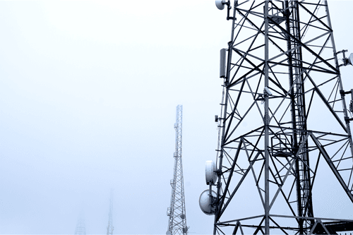 Multiple telephone towers in fog