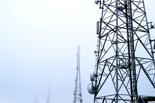 multiple telephone towers in fog